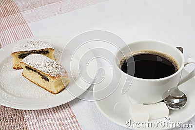 Bun filled with poppy seeds served with coffee