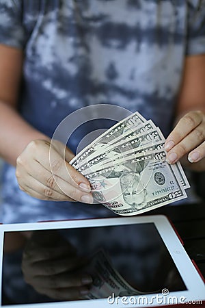 A bundle of money in the hands against