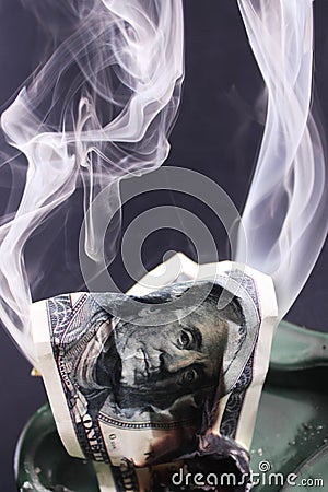 Burning dollar bill