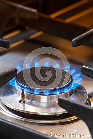 Burning gas stove with blue flames