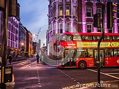 Bus crosses Great Russell Street, London, at night