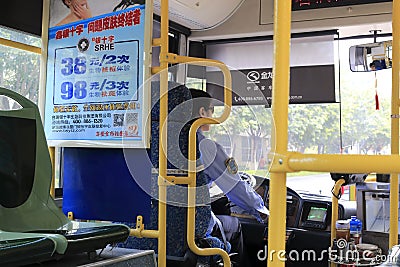 Bus driver sitting in her bus in amoy city