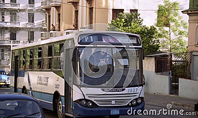 Bus drives downs street in Havana