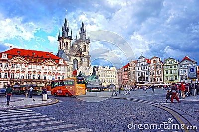 Bus in Old Town Square waiting tourists for guided tour of the main attractions of the city in Prague
