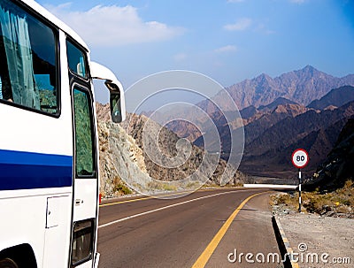 Bus rides on road