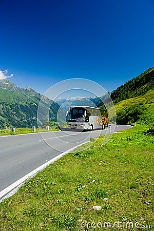 Bus on a road in Alps