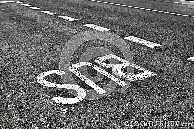 Bus sign on tarmac road