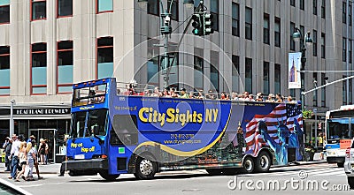 Bus tour driving through manhattan midtown