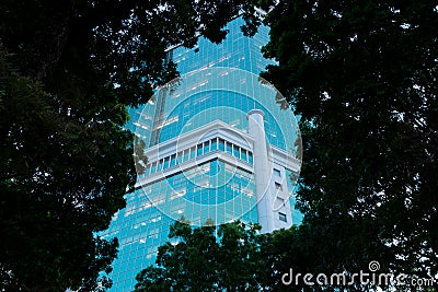 Business centre. Evening view through trees.