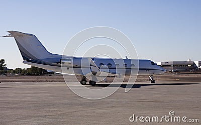 Business jet taxiing to the gate