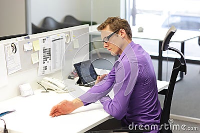 Business man exercising during work