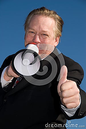 Business man giving thumbs up.
