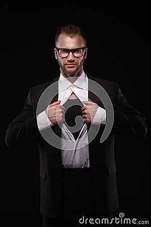 Business man in glasses tearing off his shirt