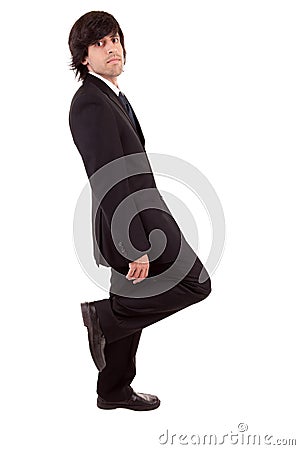 business-man-leaning-against-wall-228258