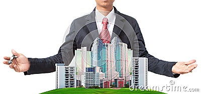 Business man and modern building on green grass field use for land management theme