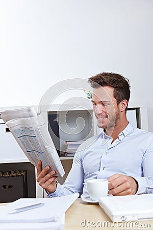 Business man in office reading