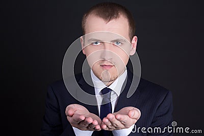 Business man presenting something on his hand