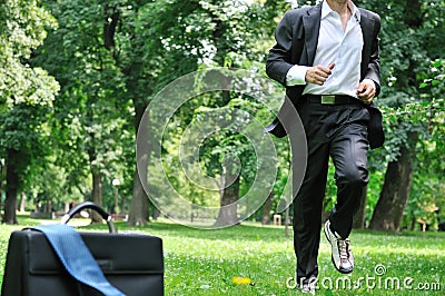 Business man running in park - training