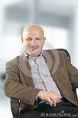 Business man sitting on a chair