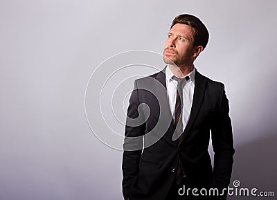 Business man in a suit looking up