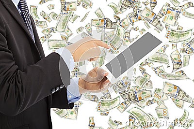 Business man touching tablet with money rain