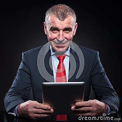 Business man working on his tablet pad computer