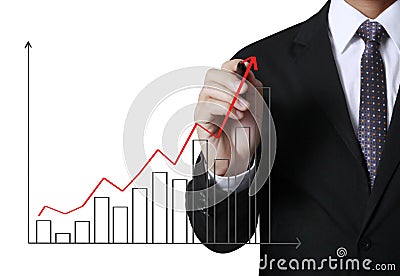 Business man writing over target graph