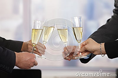 Business people celebrating with champagne