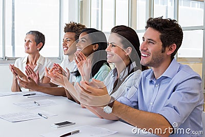 Business people clapping after presentation