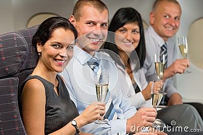 Business people flying airplane drink champagne