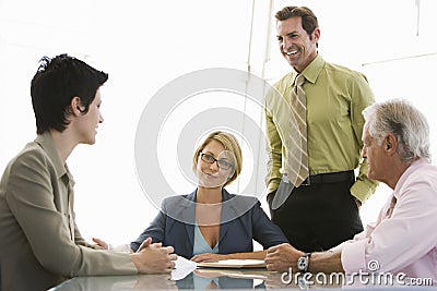 Business People Having Discussion At Conference Table