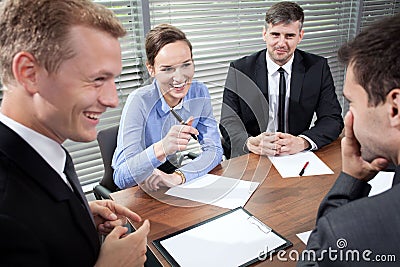 Business people laughing during business meeting