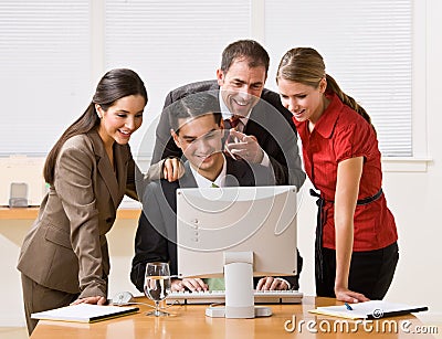 Business people looking at computer