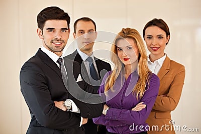 Business people smiling with arms crossed