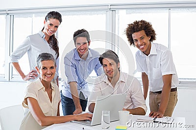 Business people working on laptop smile to camera