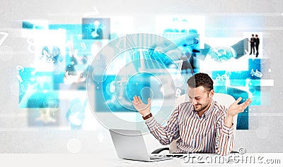 Business person at desk with modern tech images at background