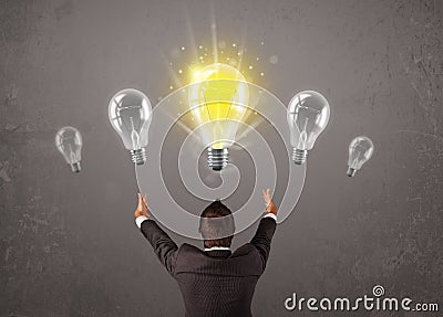 Business person having an idea light bulb concept
