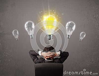 Business person having an idea light bulb concept