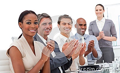 A business team applauding a presentation