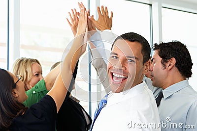 Business Team Giving One Another High Five