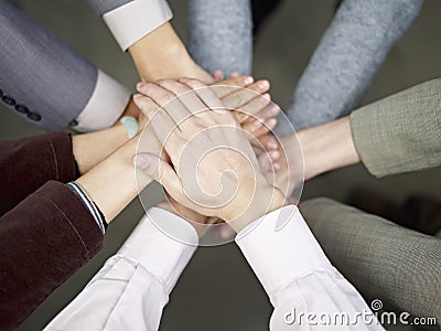 Business team putting hands together