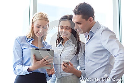 Business team working with tablet pcs in office