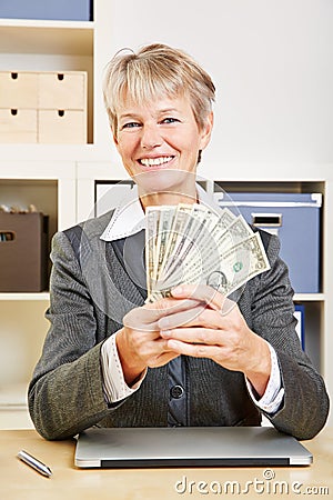 Business woman with fan of dollar