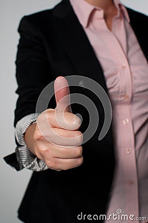 Business woman giving a thumbs up