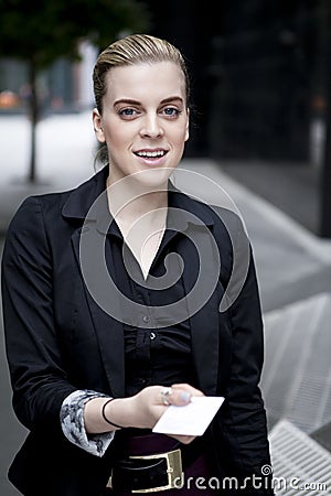 Business woman handing over business card