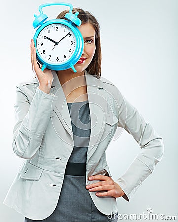 Business woman hold watch. Time concept. Smiling girl portrait,