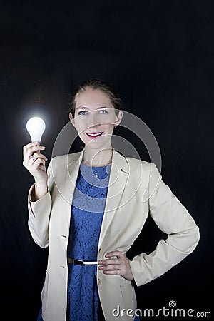 Business woman holding light bulb