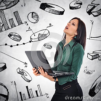 Business Woman with laptop computer analyzing infographics