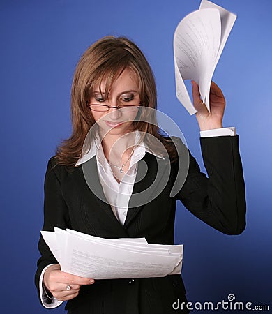 Business woman reading impatiently a file