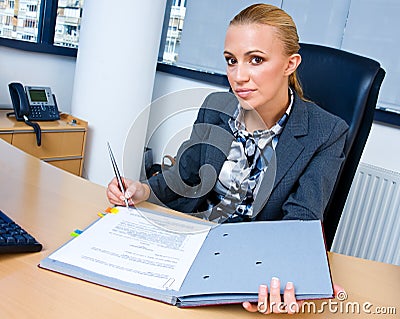 Business woman signing documents